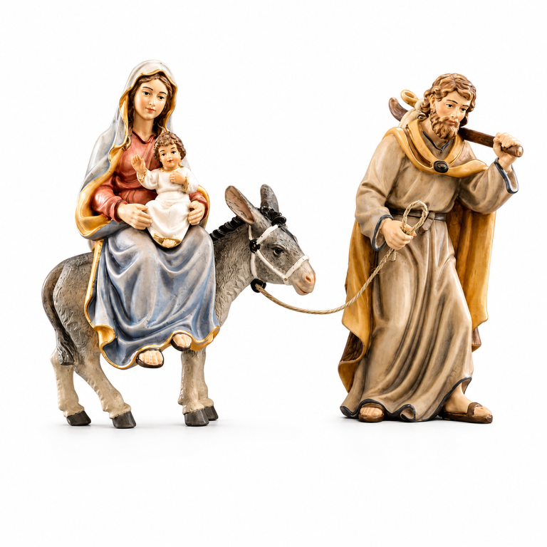Heilige Familie auf der Flucht nach Ägypten – Maria mit Jesuskind auf dem Esel und Josef als holzgeschnitzte Krippenfigur