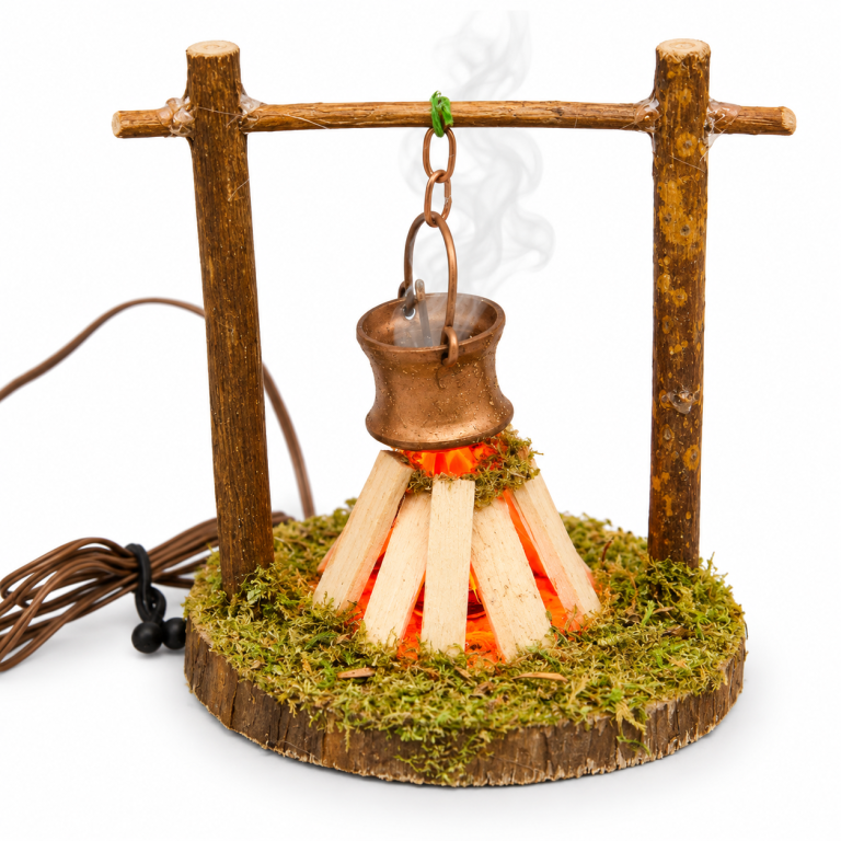 Beleuchtetes Rauch-Lagerfeuer mit Kupferkessel für die Krippe